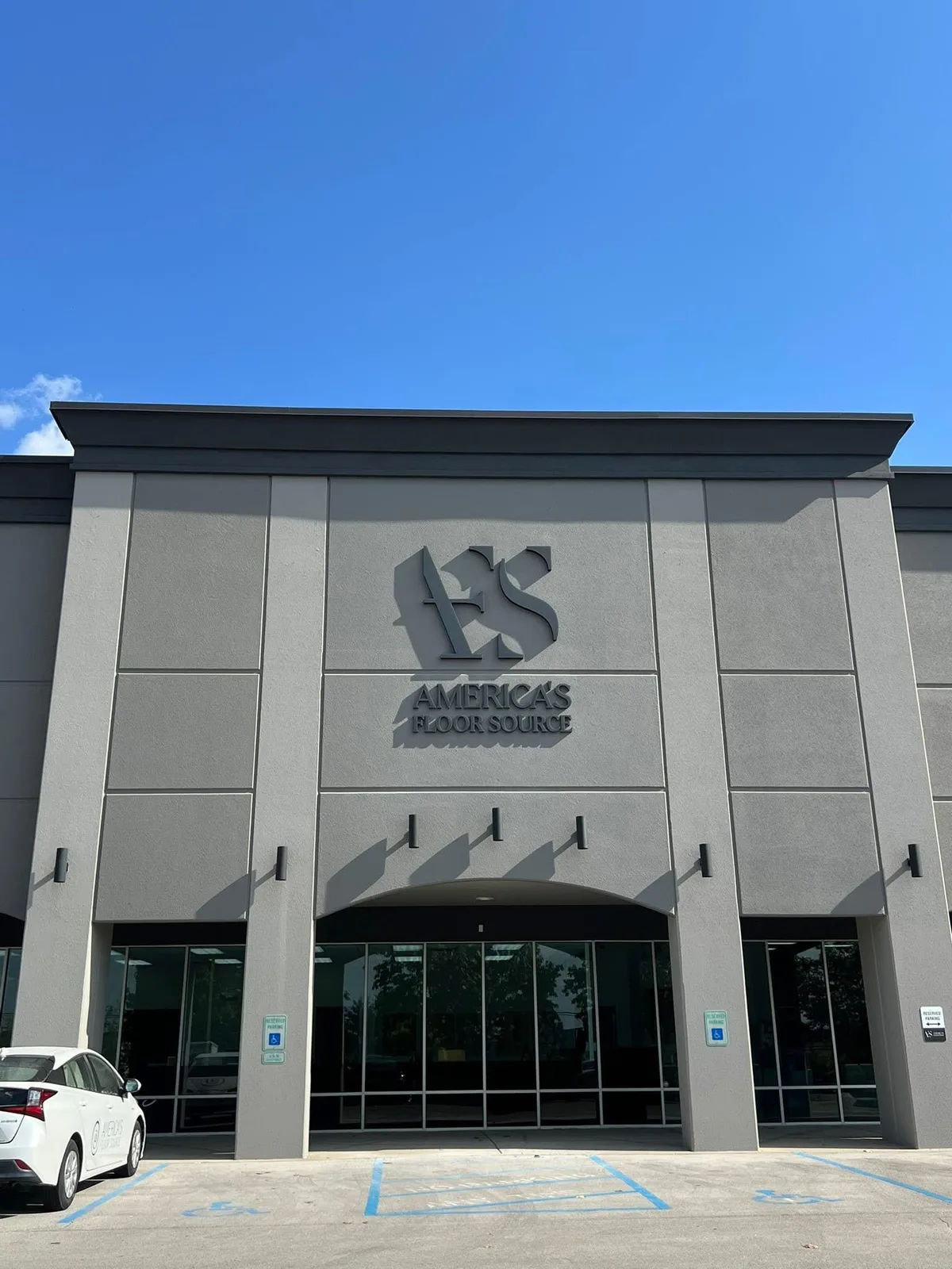 Freshly painted America's Floor Source commercial building exterior